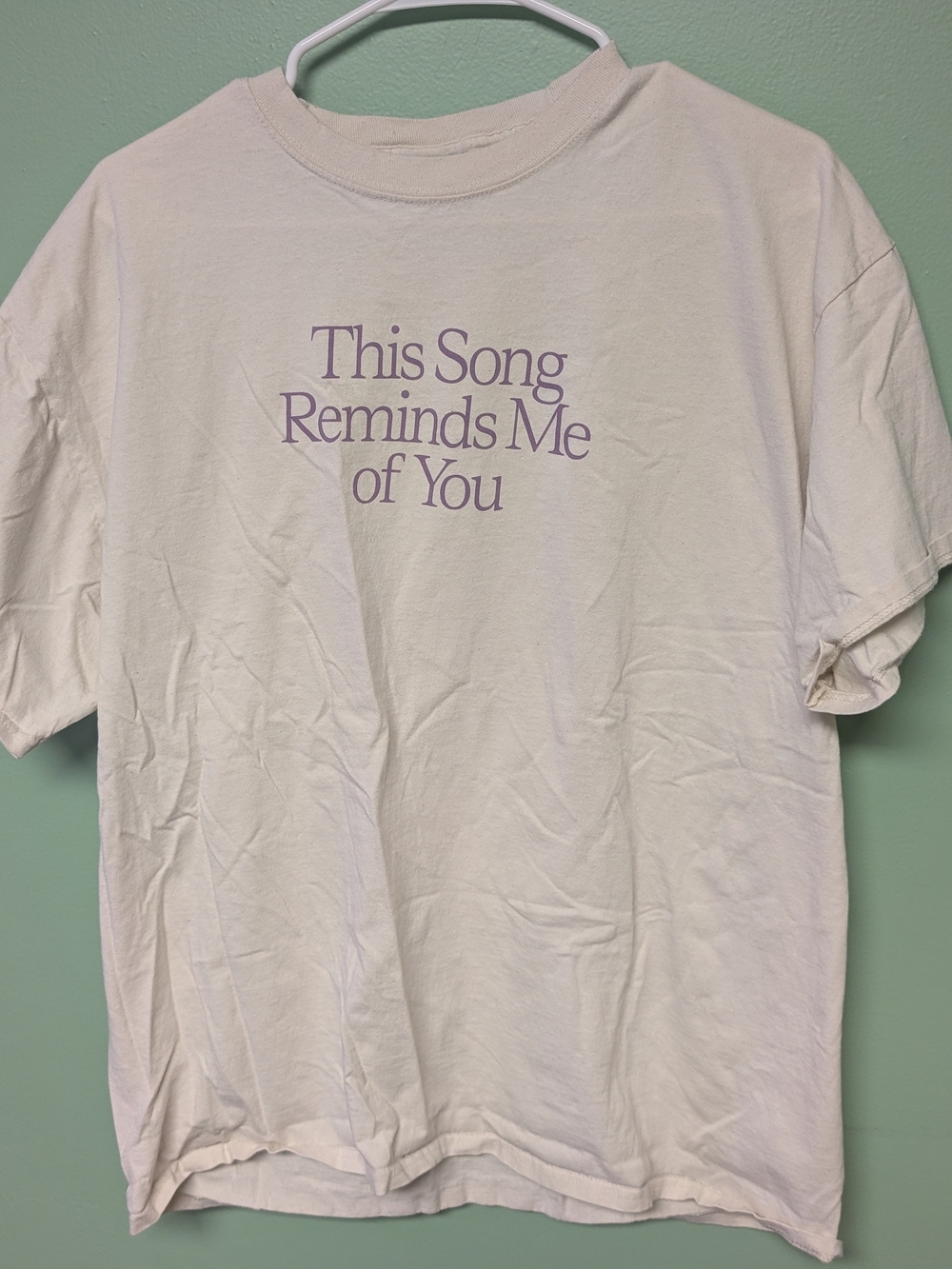 LONELY GHOST Cream Tee with Purple Text - "This Song Reminds Me of You"